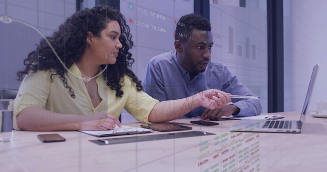 Two Professionals Analyzing Data on Laptop in Office - Download Free Stock Images Pikwizard.com