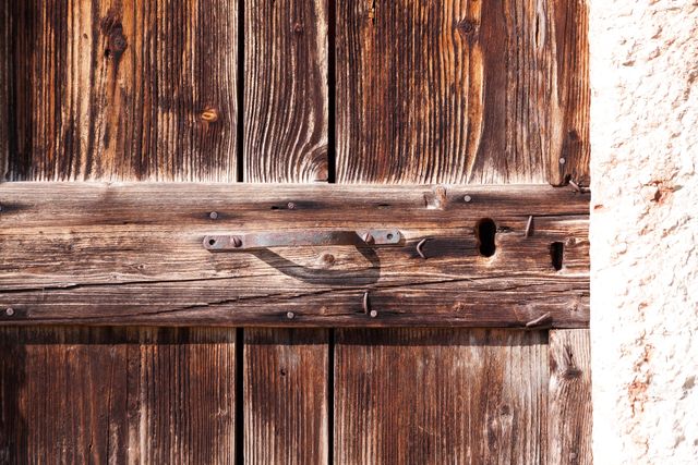 Close-Up of Rustic Wooden Door with Weathered Lock and Handle - Download Free Stock Photos Pikwizard.com