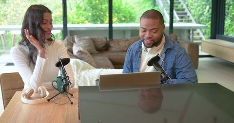 Recording home podcast with diverse cohosts using condenser microphones and laptop