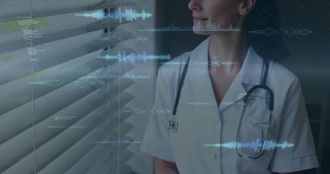 Nurse standing by window wearing stethoscope with futuristic medical data overlays