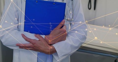 Clinician holding blue clipboard with stethoscope and network overlay in exam room