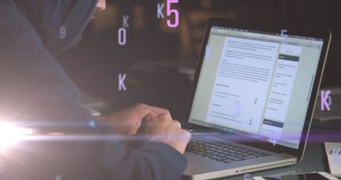 Cybersecurity expert analyzing threats on laptop with floating code