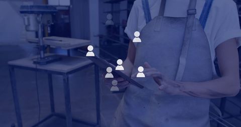 Industrial Worker Using Digital Tablet with Network Icons