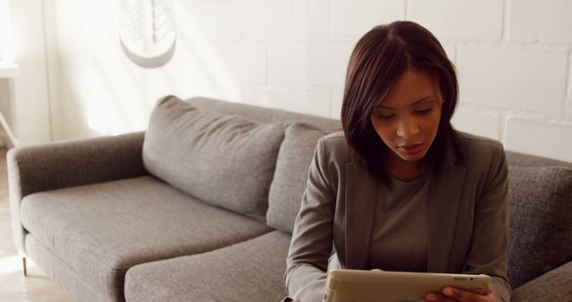 Young Businesswoman Working on Digital Tablet in Modern Office - Download Free Stock Images Pikwizard.com