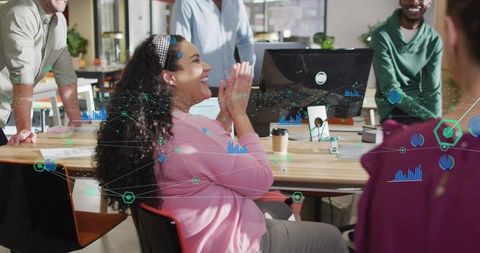 Diverse Team Celebrating Project Success in Modern Office