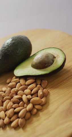 Fresh Avocado and Almonds on Wooden Board - Download Free Stock Images Pikwizard.com