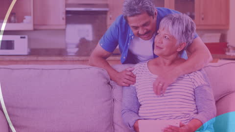 Senior Couple Using Tablet in Cozy Home Environment