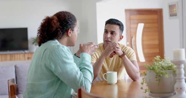 Diverse Friends Having a Serious Conversation Over Coffee at Home - Download Free Stock Images Pikwizard.com