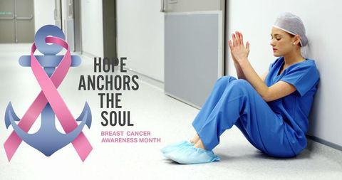 Tired Doctor with Breast Cancer Awareness Message in Hospital