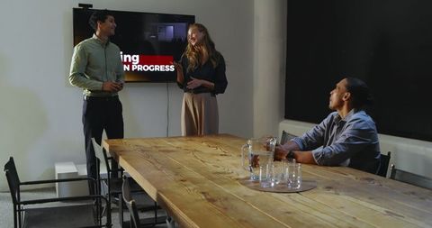 Diverse team presentation in modern office with applause