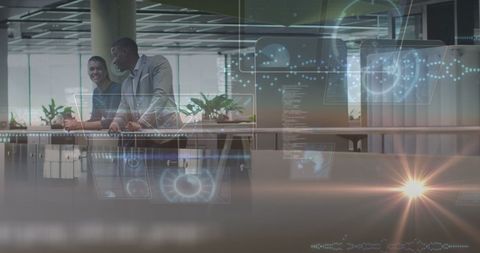 Business Professionals in Office Analyzing Data Interfaces