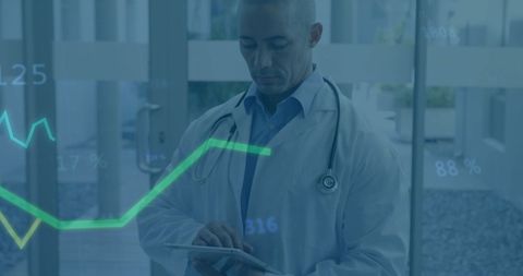 doctor analyzing financial data with tablet in hospital - Download Free Stock Images Pikwizard.com