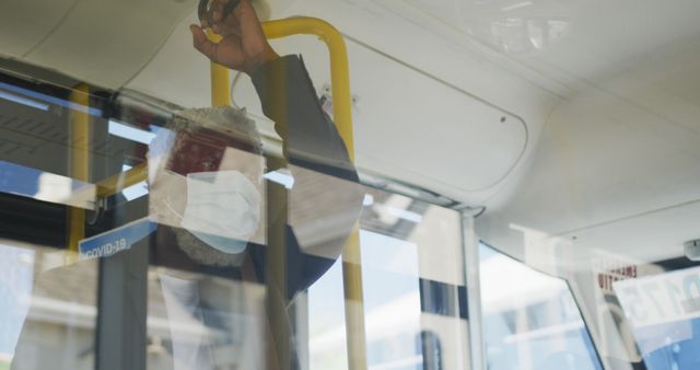 Senior Man Wearing Face Mask Holding Onto Rail Inside Public Bus - Download Free Stock Images Pikwizard.com