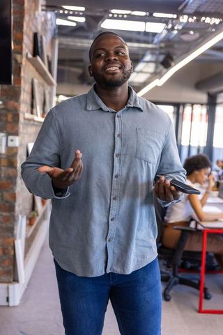 Confident professional leading team meeting in modern office
