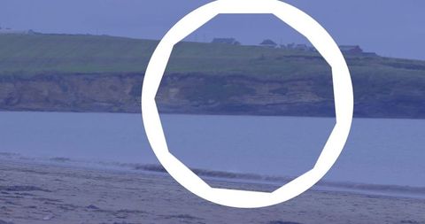 White octagonal ring framing calm beach and cliffs minimal coastal graphic composition