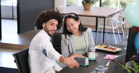 Colleagues Celebrating at Office with Cake and Selfies