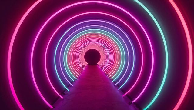 Glowing neon tunnel with vibrant led rings evoking futuristic vibe
