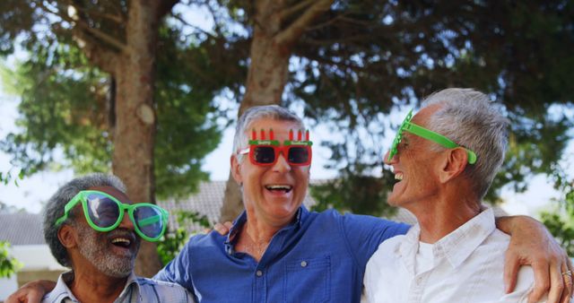 Three Senior Men Wearing Funny Glasses Smiling and Hugging Outdoors - Download Free Stock Images Pikwizard.com