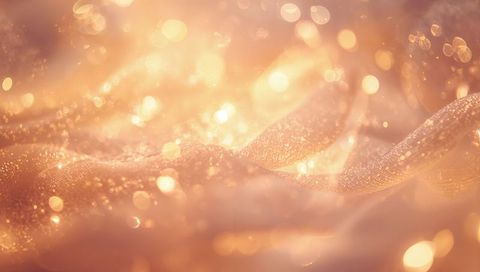 Shimmering Golden Sheer Ribbon Catching Warm Bokeh and Glitter Texture