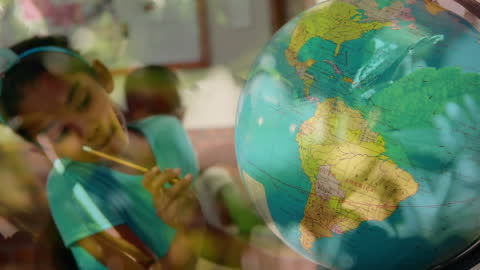 Student Studying Globe with Overlay of Leafy Plants