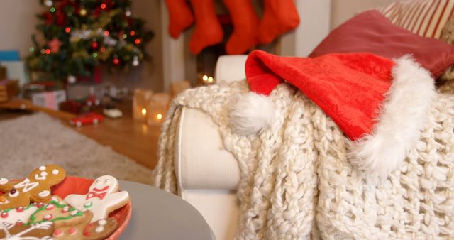 Cozy Christmas Living Room with Decorations and Santa Hat - Download Free Stock Images Pikwizard.com