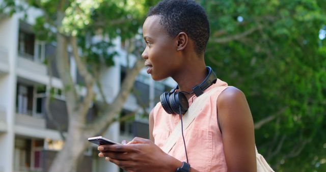 Young Woman with Short Hair Using Smartphone Outdoors - Download Free Stock Images Pikwizard.com