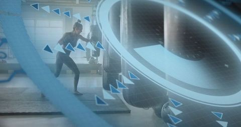Female Athlete Punching Heavy Bag in Industrial Gym with Futuristic HUD Overlays