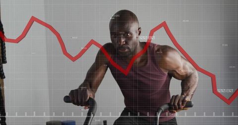 Man exercising on stationary bike with financial graph overlay