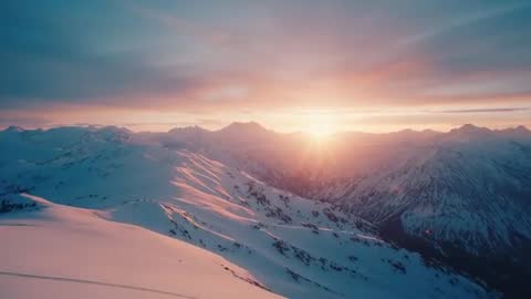 Sunrise Over Snow-Covered Mountain Peaks at Dawn