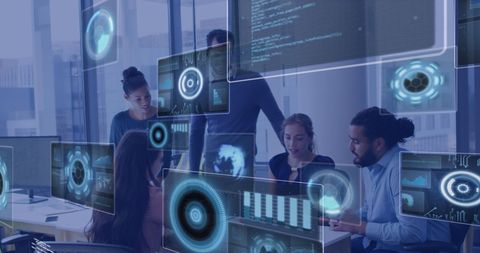 Diverse team analyzing data with futuristic software in modern office