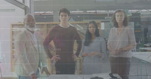 Diverse team analyzing graph overlays in industrial workspace setting