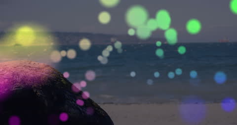 Vibrant Light Spots Interspersed Over Tranquil Beach