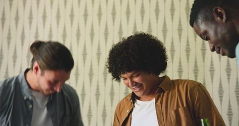 Friends Celebrating with Laughter and Drinks