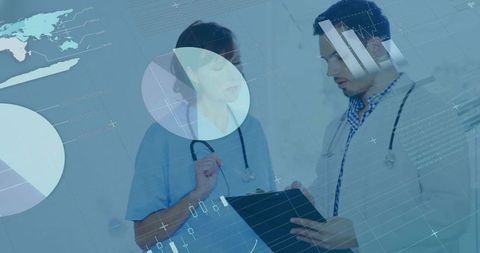 Medical team reviewing patient data on digital dashboard in hospital corridor
