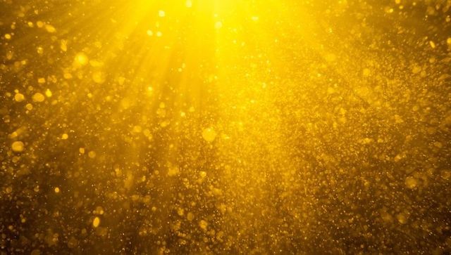 Radiant Golden Light Particles with Shimmering Effect