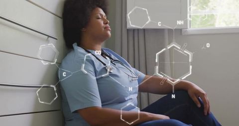 Exhausted Female Doctor with Medical Innovations Concepts