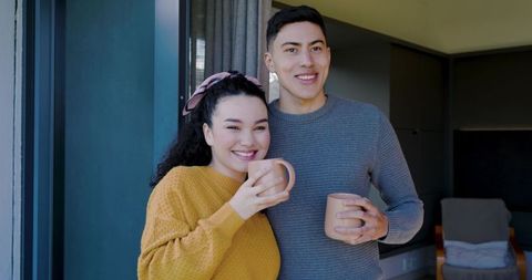 Happy Couple Enjoying Coffee Next to Modern Home Window