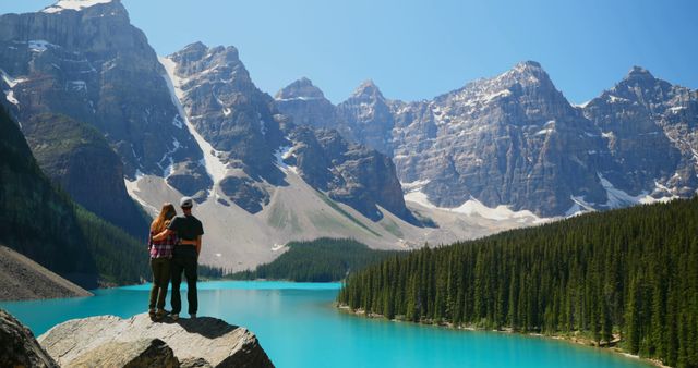 Couple Enjoying Scenic Mountain View at Lake Louise, Canada - Download Free Stock Images Pikwizard.com