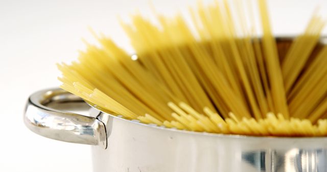 Stainless Steel Pot with Uncooked Spaghetti Ready for Boiling - Download Free Stock Images Pikwizard.com