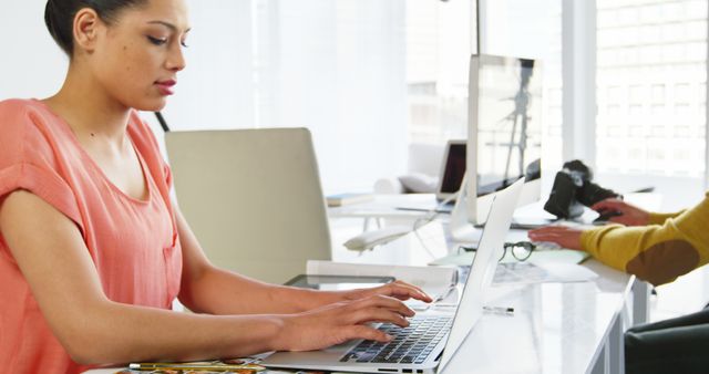 Focused Woman Working on Laptop in Modern Office Setting - Download Free Stock Images Pikwizard.com