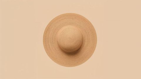 Wide-brimmed straw hat with concentric woven pattern