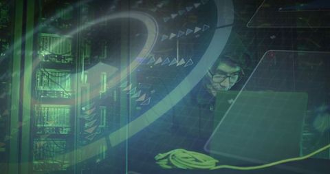 Cybersecurity Engineer Utilizing Laptop in Advanced Server Room