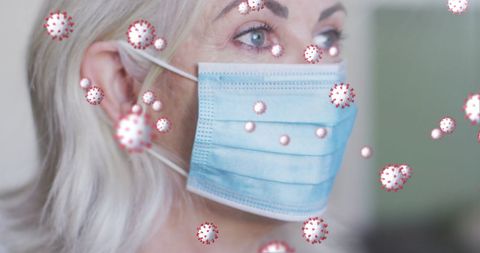 Senior Woman Wearing Mask with Digital Viruses