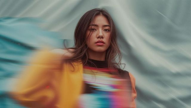 Dynamic portrait of vibrant model in studio setting