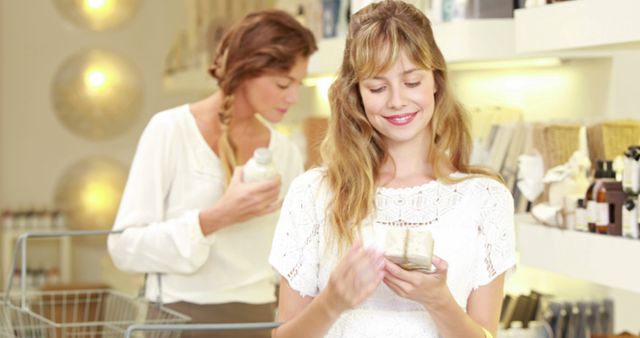 Two Women Shopping for Beauty Products in Store - Download Free Stock Images Pikwizard.com