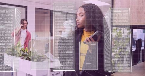 Business Leader with Holographic Data Display in Modern Office