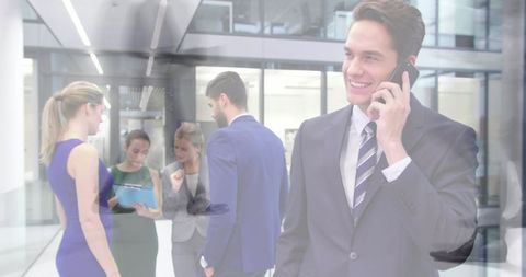Businessman Having Phone Call Amid Busy Office Environment - Download Free Stock Images Pikwizard.com