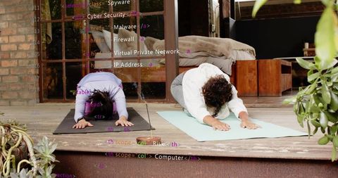 Practicing outdoor yoga on porch bending into child pose with code overlay