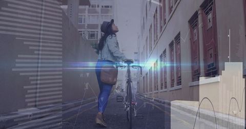 Woman Walking in Urban Alley With Bicycle and Satchel