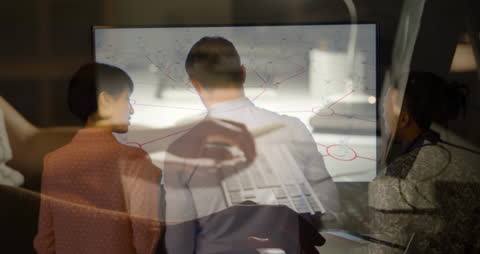 Diverse Business Team Brainstorming with Digital Interface